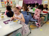 Second grader, Elizabeth Chase prepares her pencil box inside her classroom at the Abraham Lincoln elementary school, as students across New Bedford return to school.  [ PETER PEREIRA/THE STANDARD-TIMES/SCMG ]